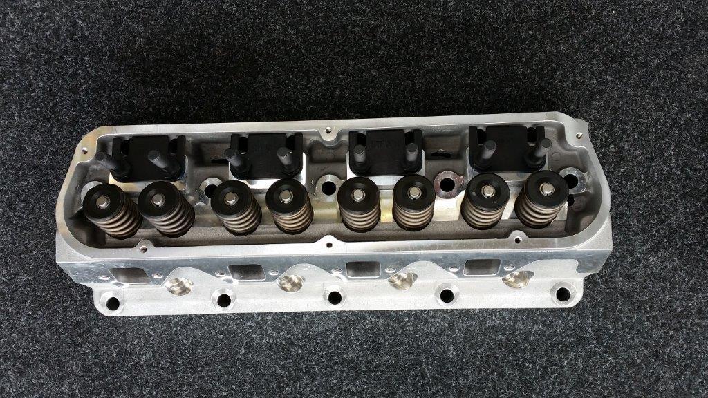CYLINDER HEADS FORD SB SRP ALLOY 170CC INTAKE-60CC EXH RUNNERS - 60CC CHAMBER - 2.02-1.60 STAINLESS STEEL VALVES - SPRING INSTALL HEIGHT 1.73@145LBS - MAX V/SPRING LIFT .575@315LBS - ONE PAIR. RECOMMEND AUT3924 PLUG